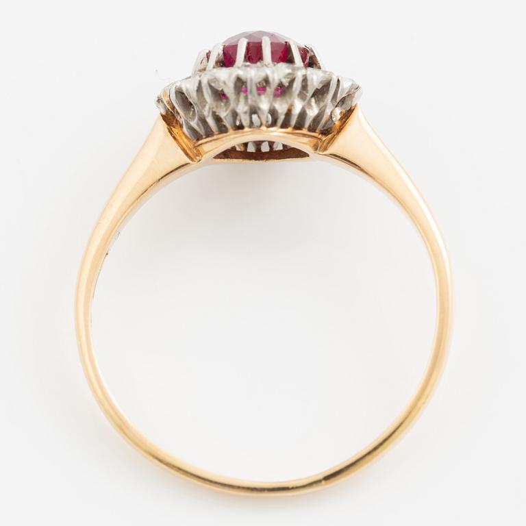 Ring in 18K gold set with a faceted synthetic ruby and eight-cut diamonds.