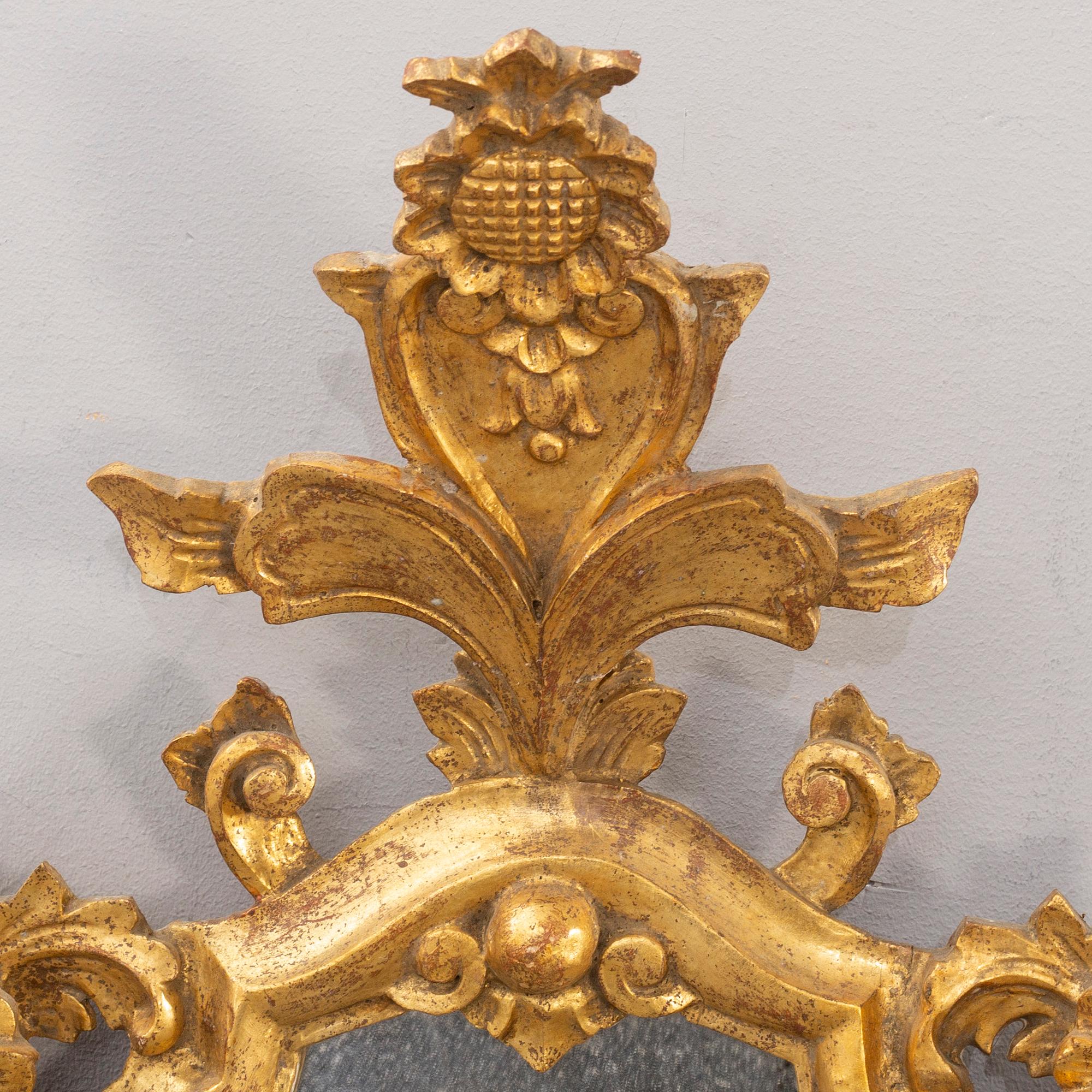 A pair of mid 20th century wood mirrors in Louis XV-style from Paoletti, Firenze Italy.