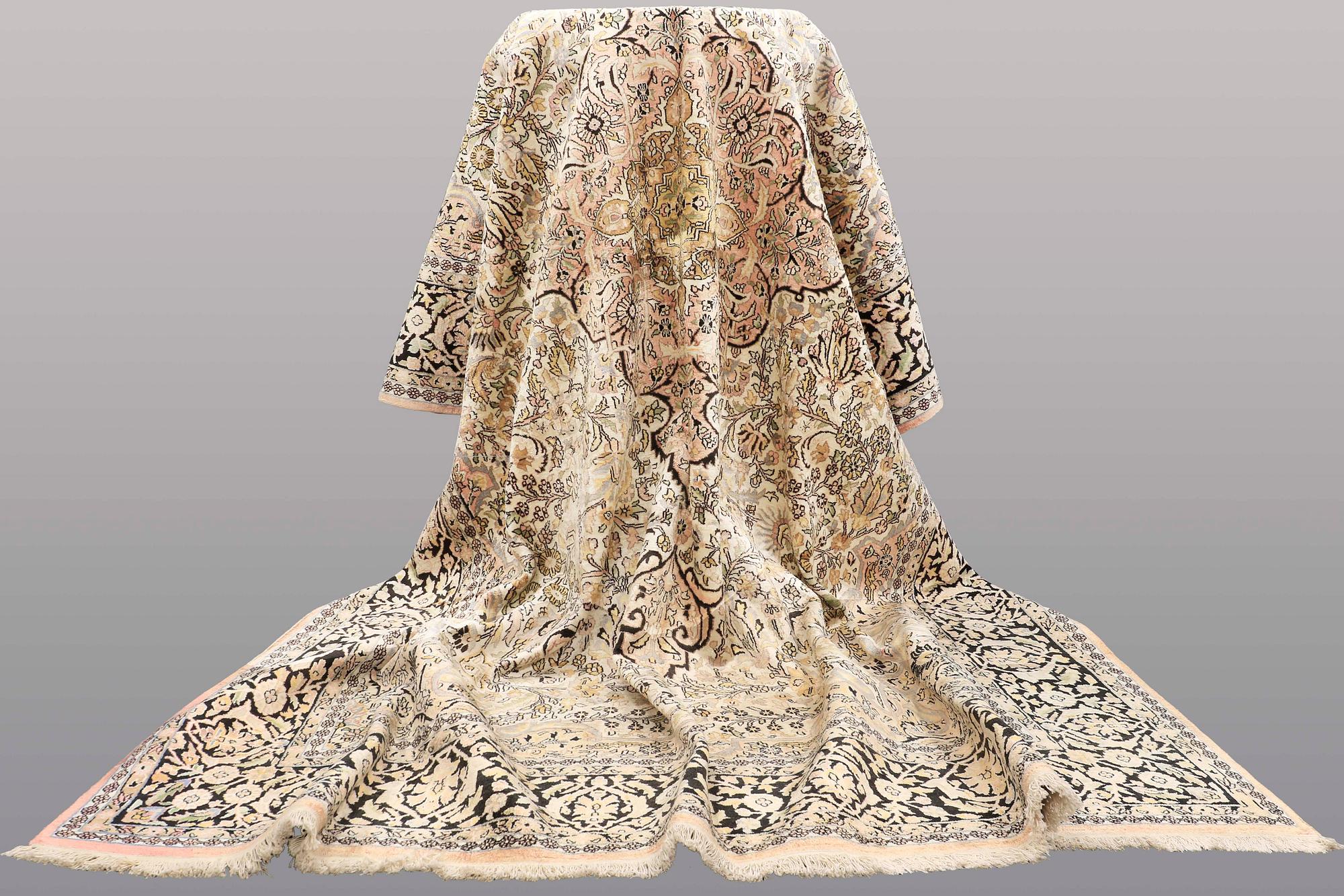 A CARPET, old silk Kashmir, ca 380 x 274 cm.