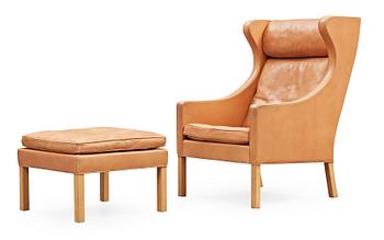 22. A Børge Mogensen armchair and ottoman, Fredericia Stolefabrik, Denmark, model 2204 and 2202.