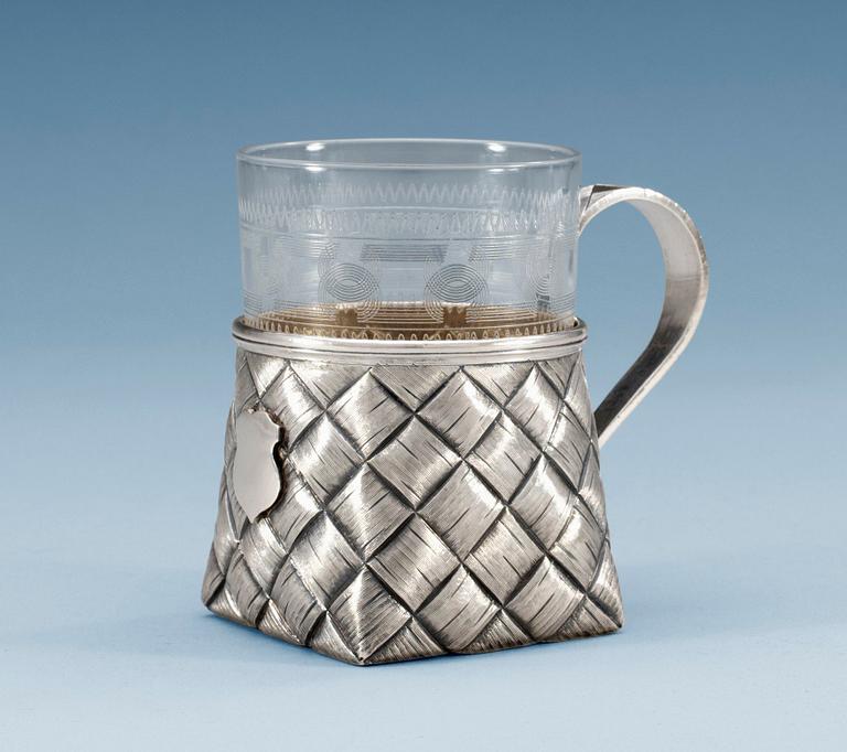A RUSSIAN PARCEL-GILT TEA-GLASS HOLDER, makers mark of Vasily Iconikov, S:t Petersburg 1894.