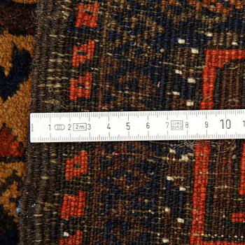 A rug, a semi-antique Baluch, ca 166 x 92 cm.