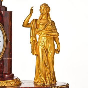 A French Empire 19th century gilt bronze mantel clock signed Lamiral.