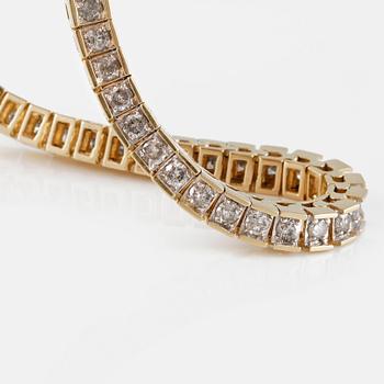 ARMLÄNK, 14K guld med briljantslipade diamanter ca 3.00 ct. Vikt 14,7 gram.