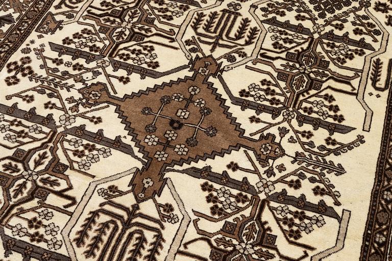 A Ferdos carpet, c. 295 x 210 cm.