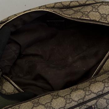 GUCCI, a monogram beauty bag.
