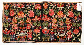 A carrige cushion, "Urnor och par", tapestry weave, ca 98 x 50 cm, around the years 1800-1825.