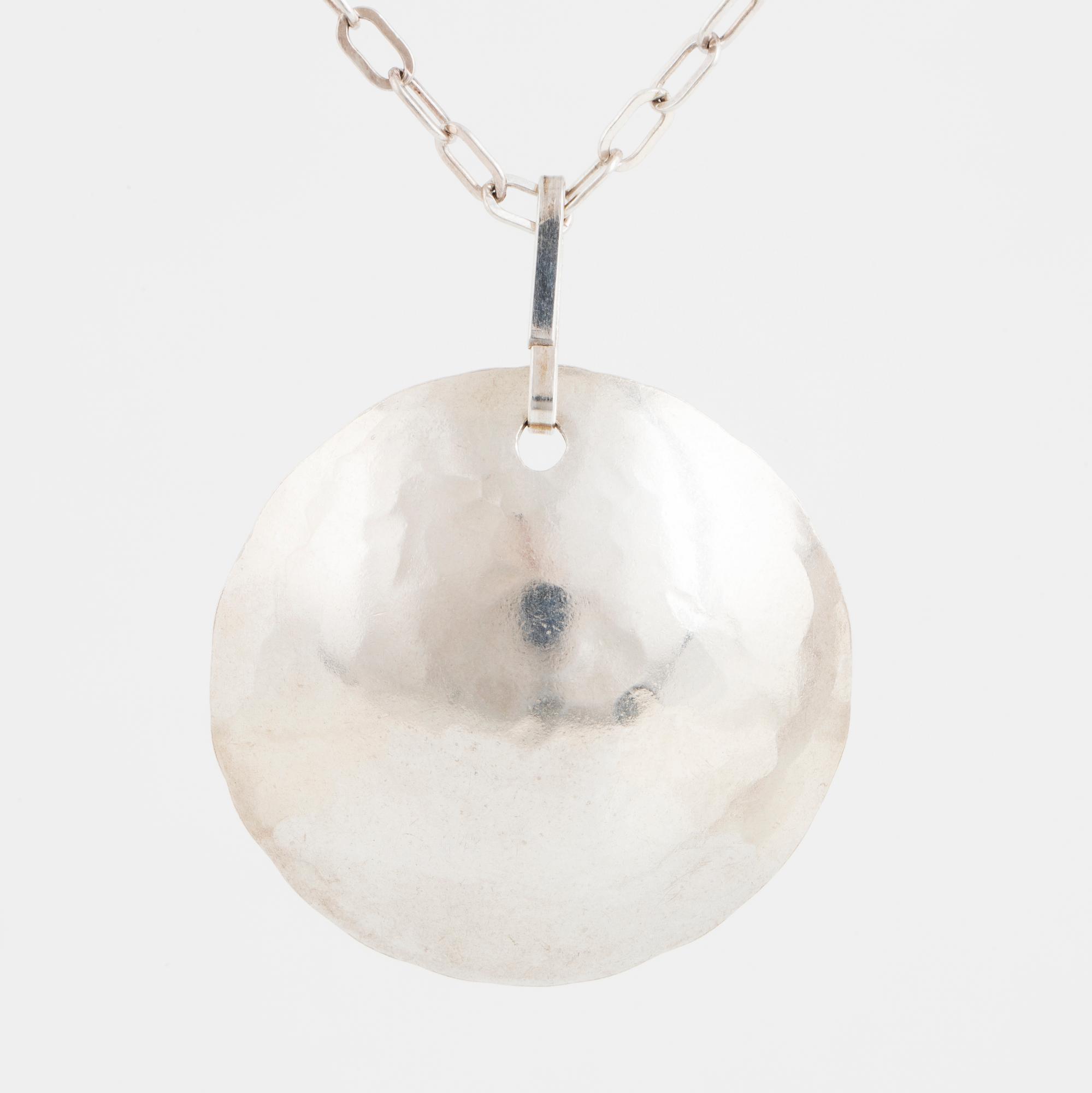 ROSA TAIKON a silver necklace.