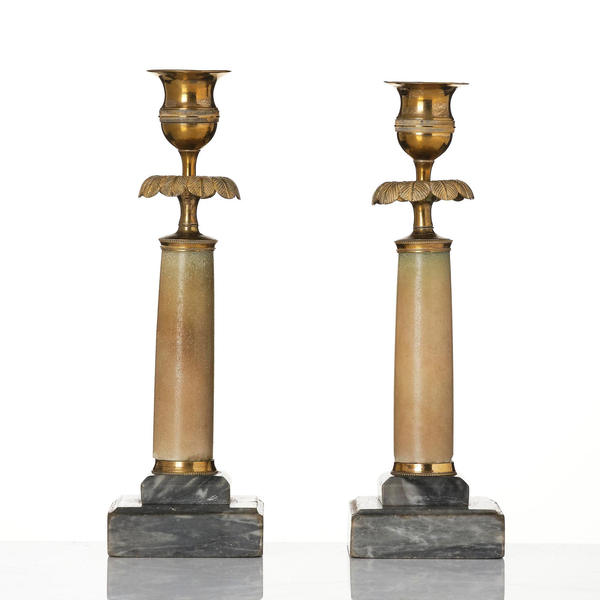 A pair of late Gustavian gilt brass and marble candlesticks, Stockholm, late 18th century.