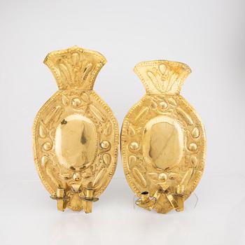 A pair of Baroque style brass wall scones around 1900.