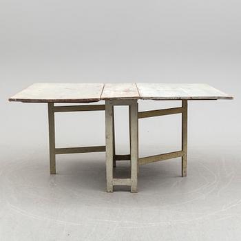 a gate-legged table from the first half of the 19th century.