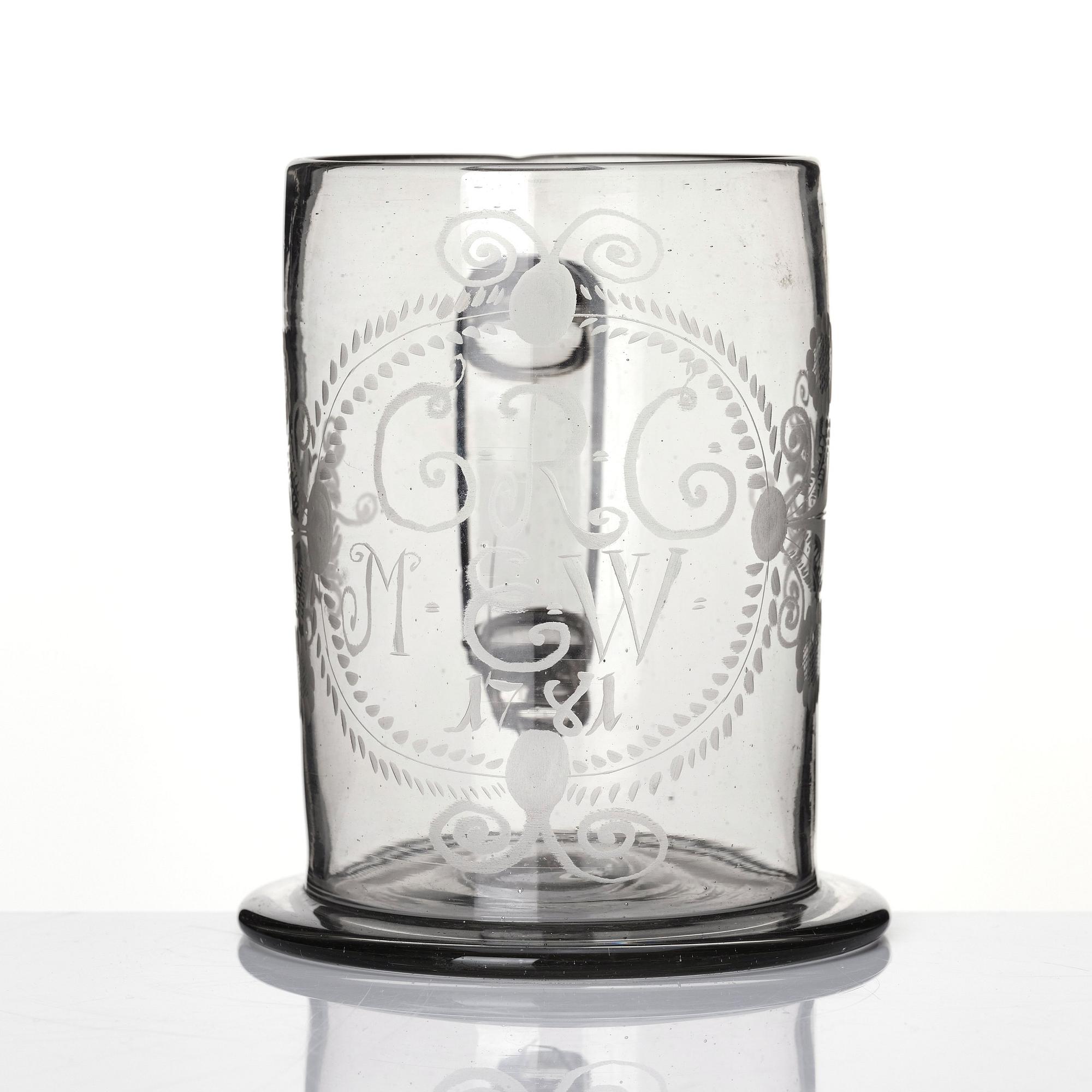 A large tankard, 18th Century with eched monogram for 'G.R.G' and 'M.E.W.' 1781.