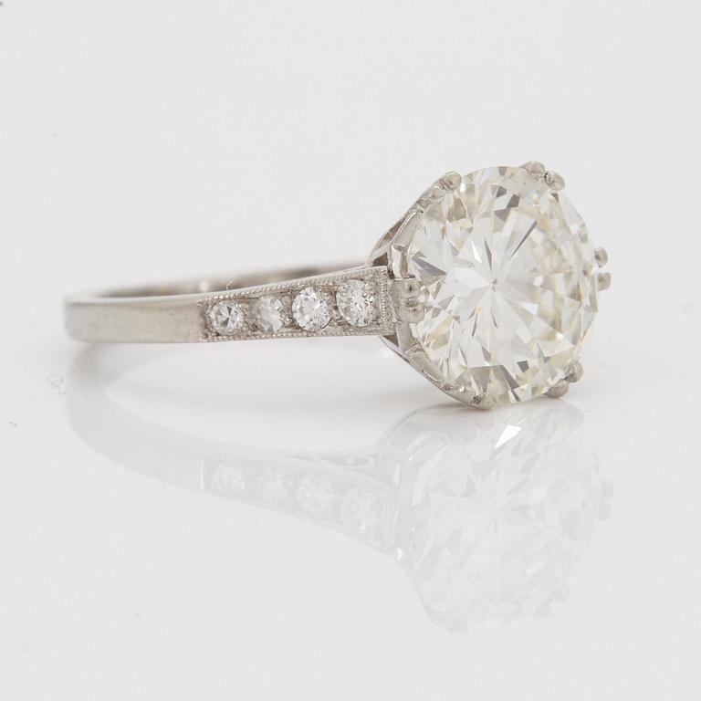 A SOLITAIRE RING with an old-cut diamond 2.56 cts.