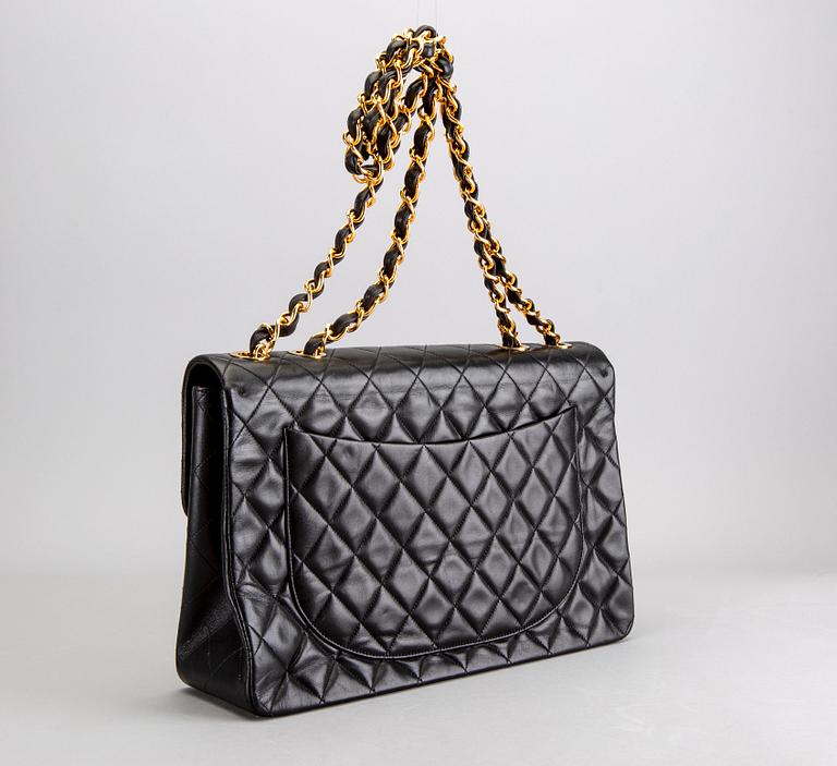 A Chanel maxi jumbo leather bag.