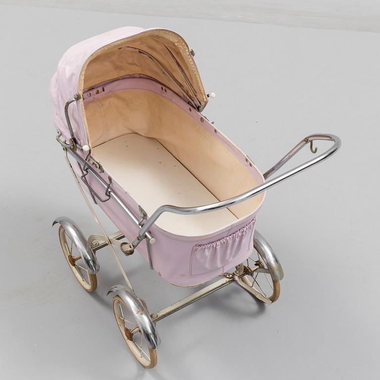 A TOY BABY CARRIAGE, 1960s.