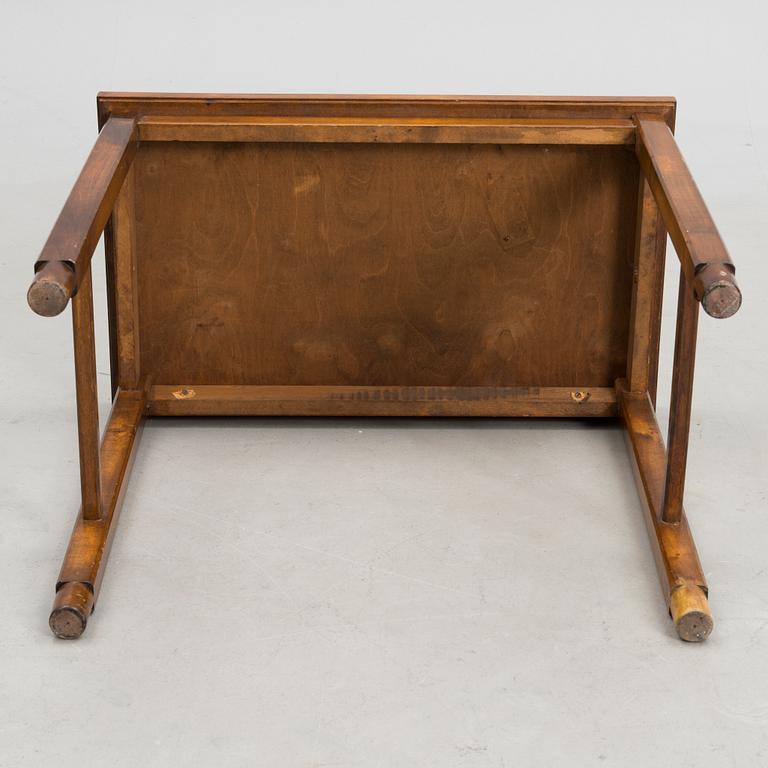 A stoneware tray table signed Bryk.