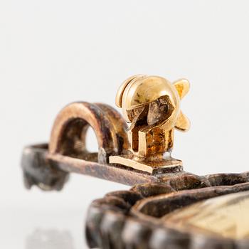 A brooch/pendant, gold and silver with topaz and old-cut diamonds, circa 1900.
