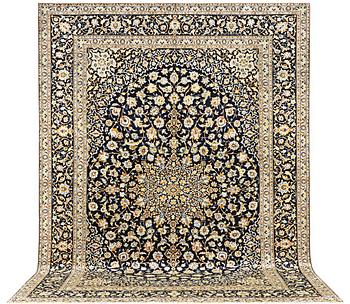 A Kashan carpet, a. 422 x 306 cm.