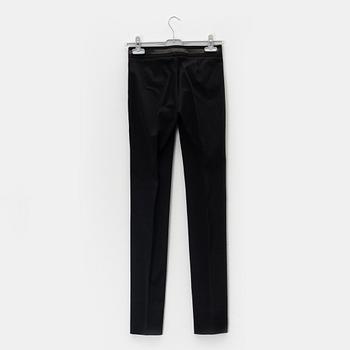 Gucci, a pair of black pants, size 38.