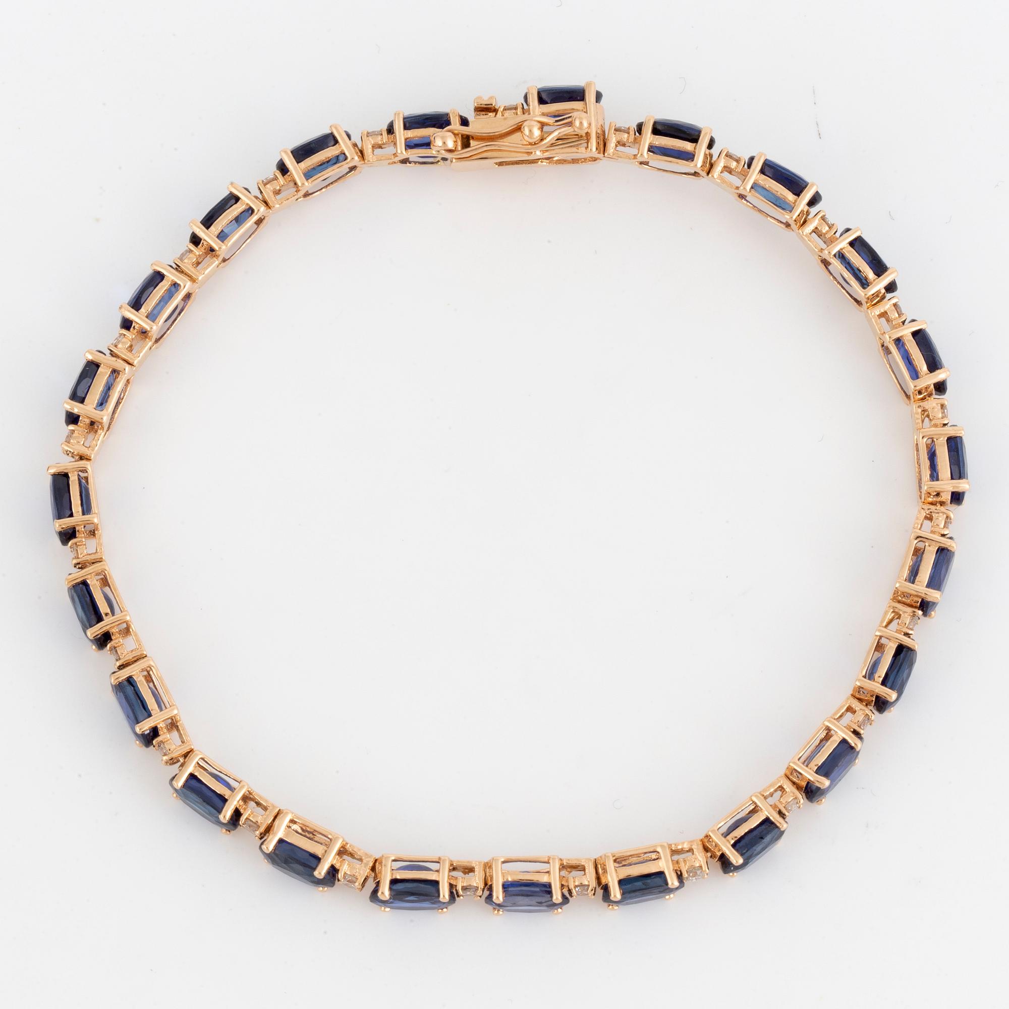 ARMBAND, med safirer och briljantslipade diamanter.