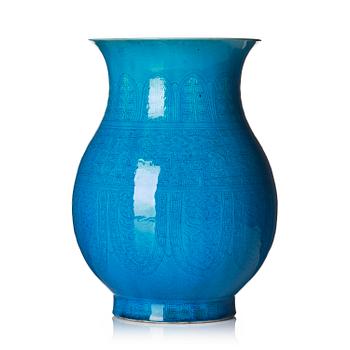 1014. A turquoise glazed vase, zun, Qing dynasty with a Qianlong incised seal mark and of the period.