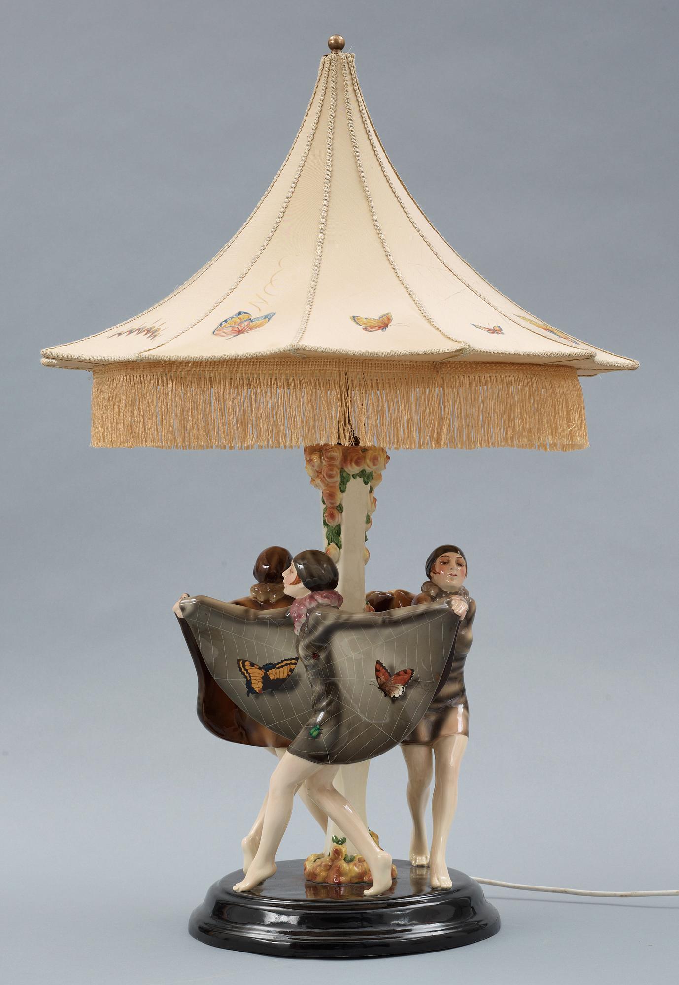 A Josef Lorenzl "The captured bird" triple figural lamp, Goldscheider, Wien circa 1925.