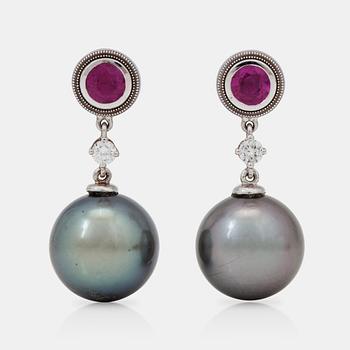 1184. A pair of cultured tahiti pearl, ruby and brilliant-cut diamond earrings.