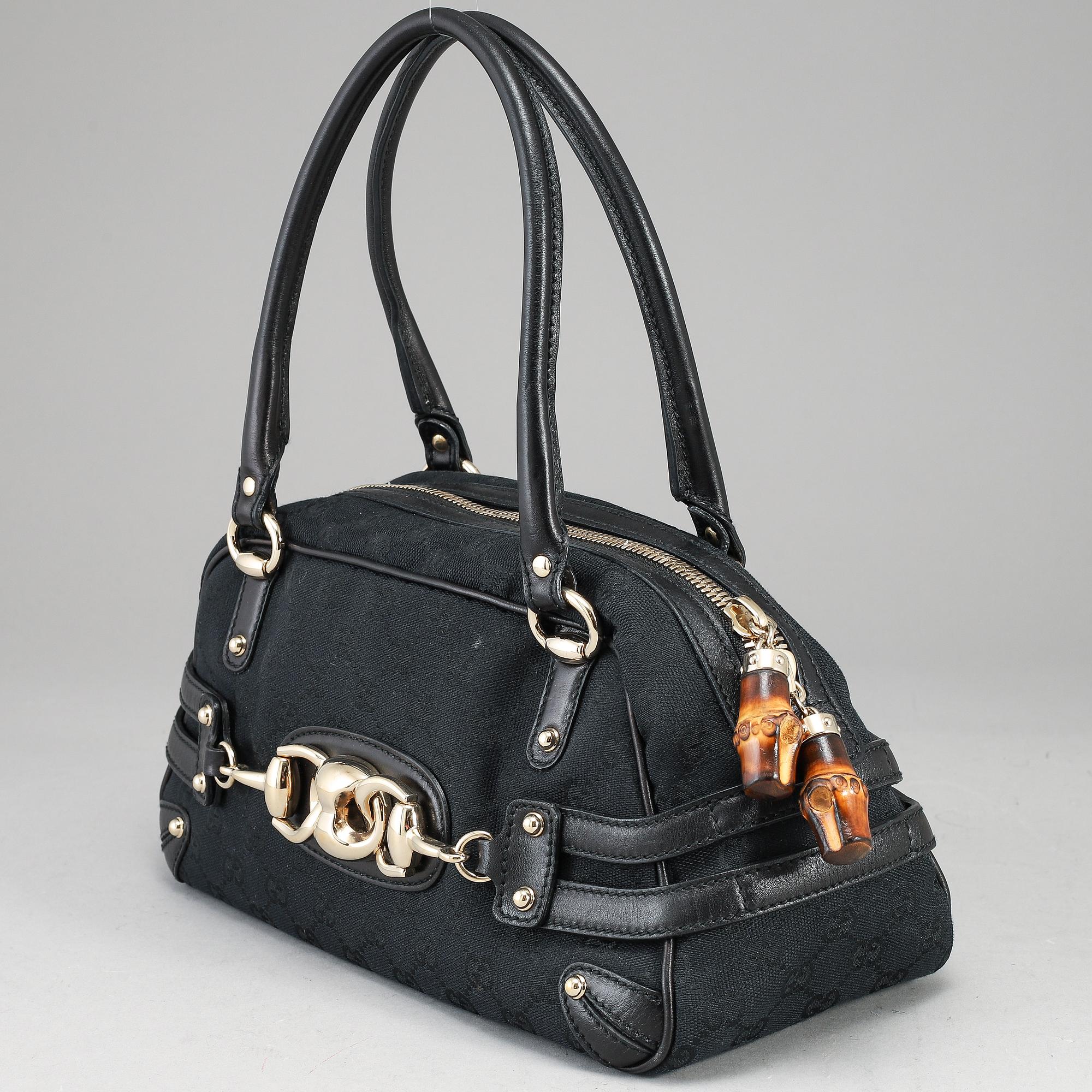 GUCCI, 'GG Canvas Horsebit Wave Handbag'.