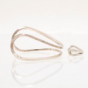 A silver ring and bracelet "loop cuff" by Efva Attling.