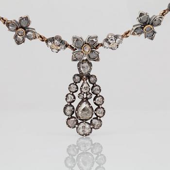 A rose-cut diamond necklace.