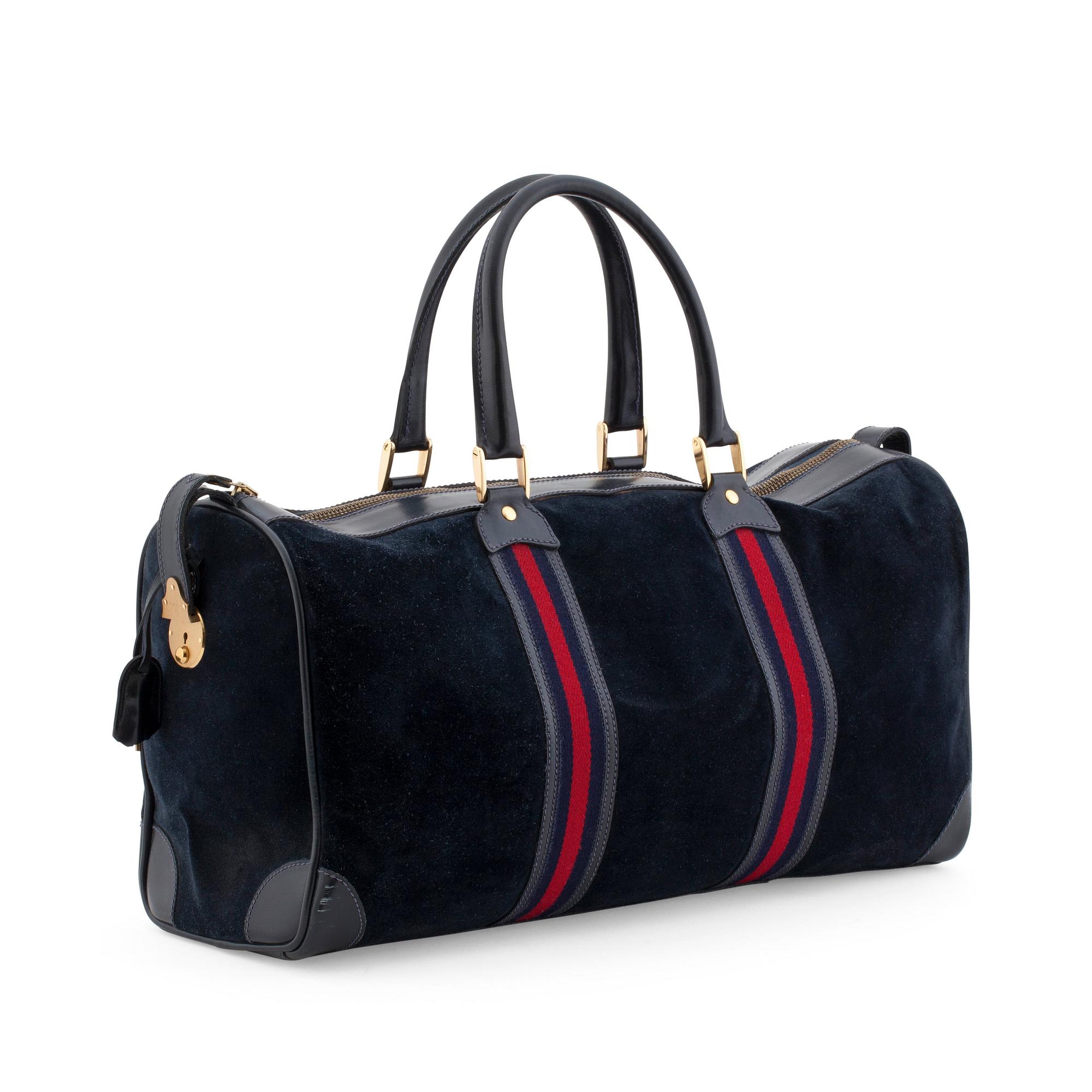 GUCCI, a blue suede and leather weekendbag.