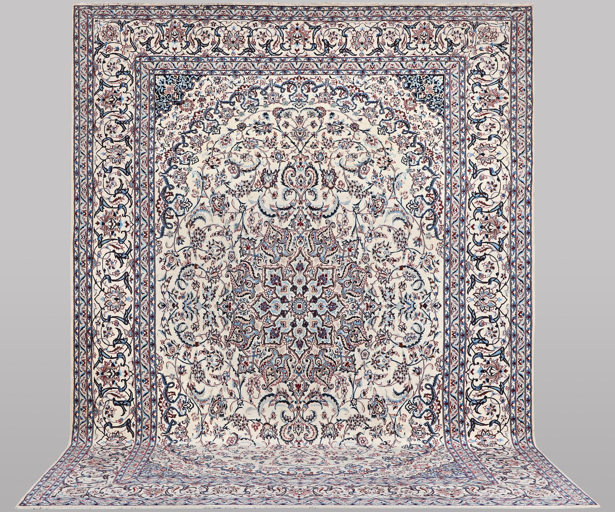 A carpet, Nain, part silk, ca 426 x 309 cm.