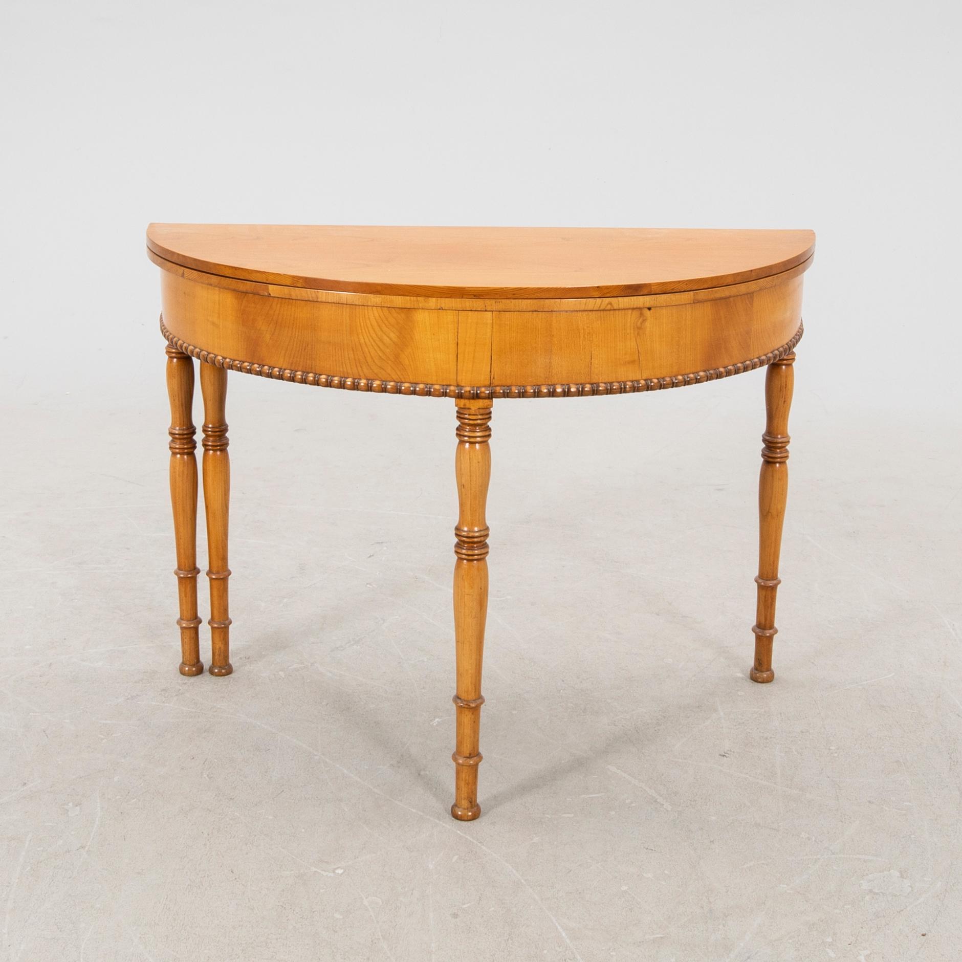 A kid 1800s late Empire birch game table.