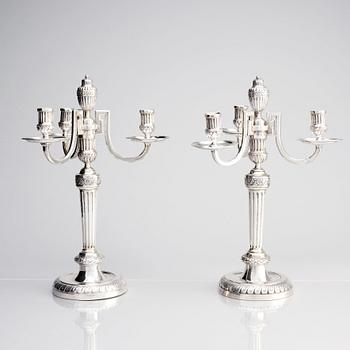A pair of Austrian Royal, Three-armed silver candelabras, marks of lgnaz Joseph Würth, Vienna 1779.
