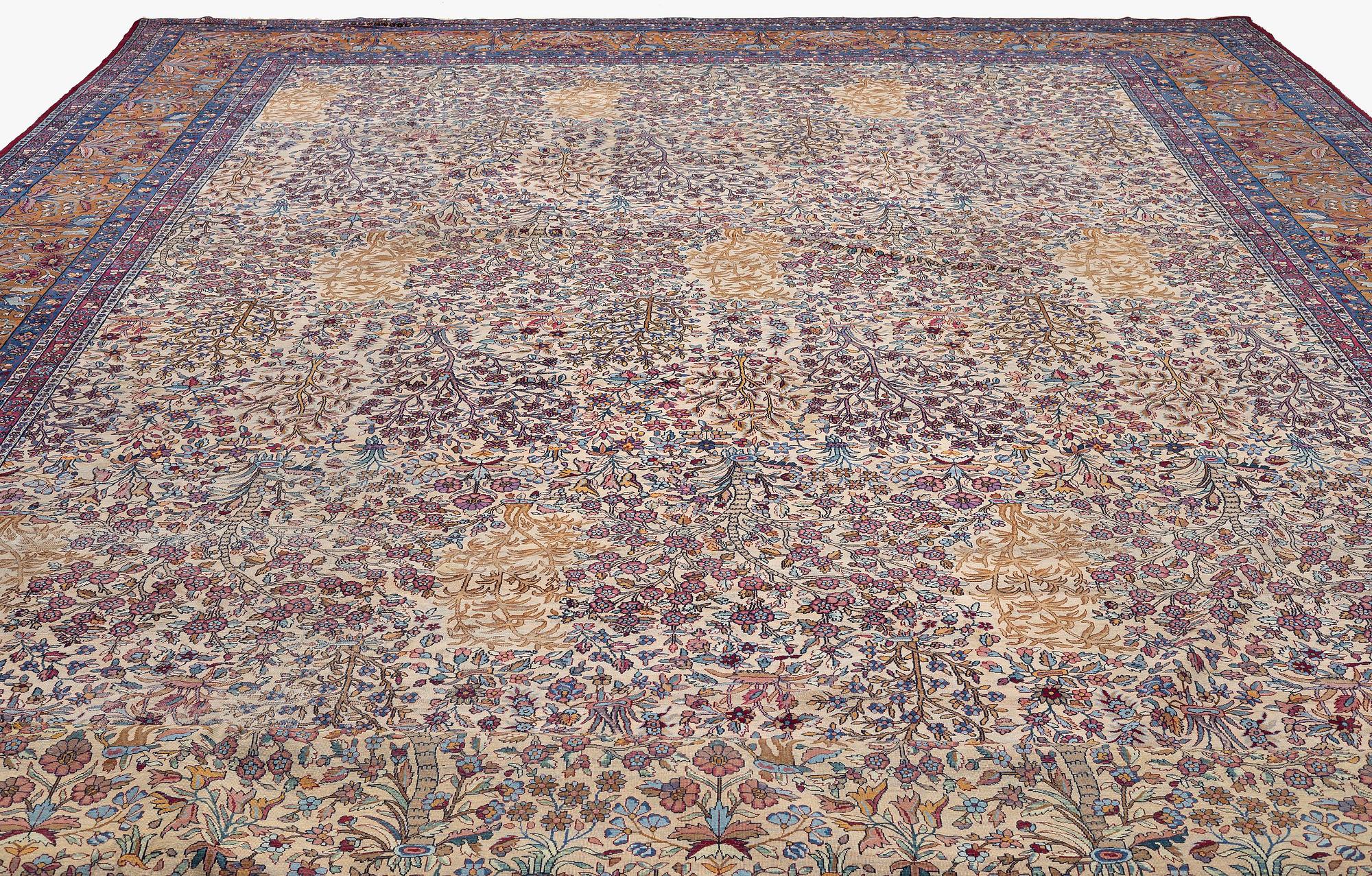 An antique 'Millefleur' Kerman Laver carpet, c. 964 x 426 cm.