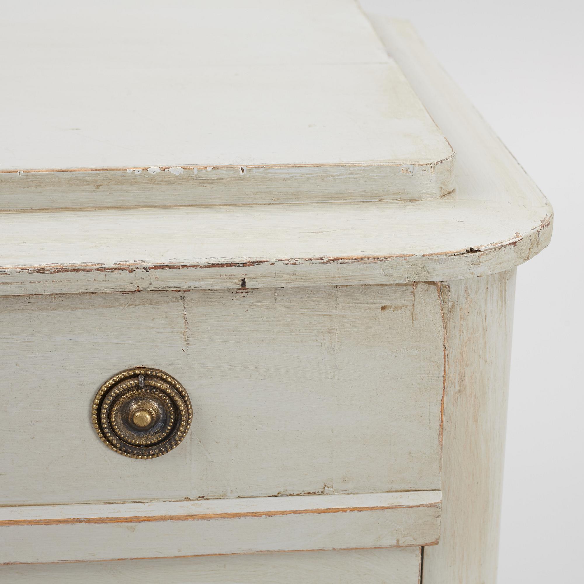 A chest of drawers, circa 1900.
