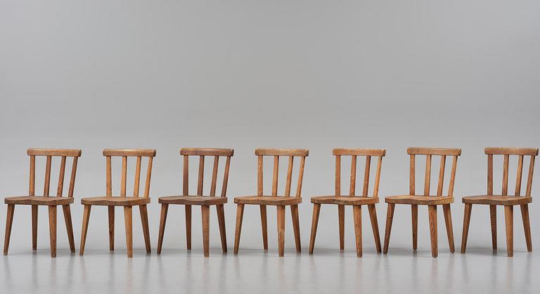 Axel Einar Hjorth, a set of seven stained pine "Utö" chairs, Nordiska Kompaniet, Sweden, 1930s.