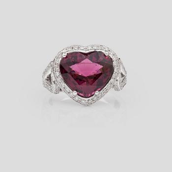 A 6.12 ct heart-shaped rhodolite garnet and brilliant-cut diamond ring. Total carat weight of diamonds circa 0.98 ct.