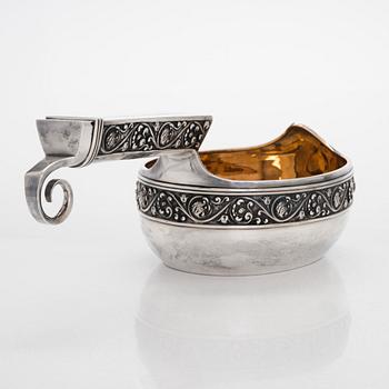 A parcel-gilt kovsh, maker's mark of Mikhail Tarasov, Moscow 1908-14. Length 40 cm.