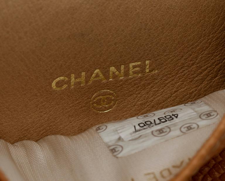 A beige leather case by Chanel.