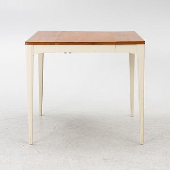 A dining table, mid-20th century.