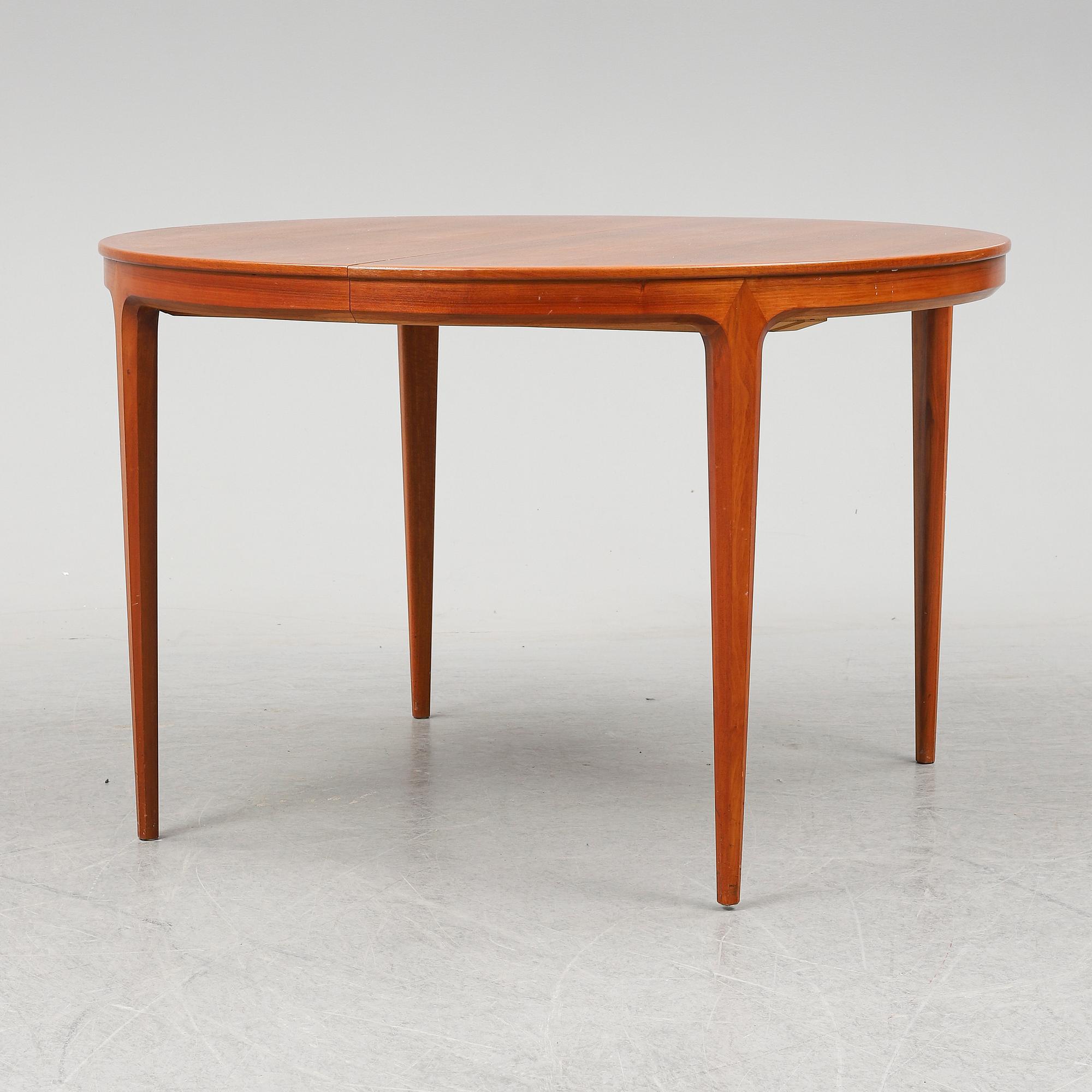 BERTIL FRIDHAGEN, a seven  piece walnut dining suite from Bodafors.