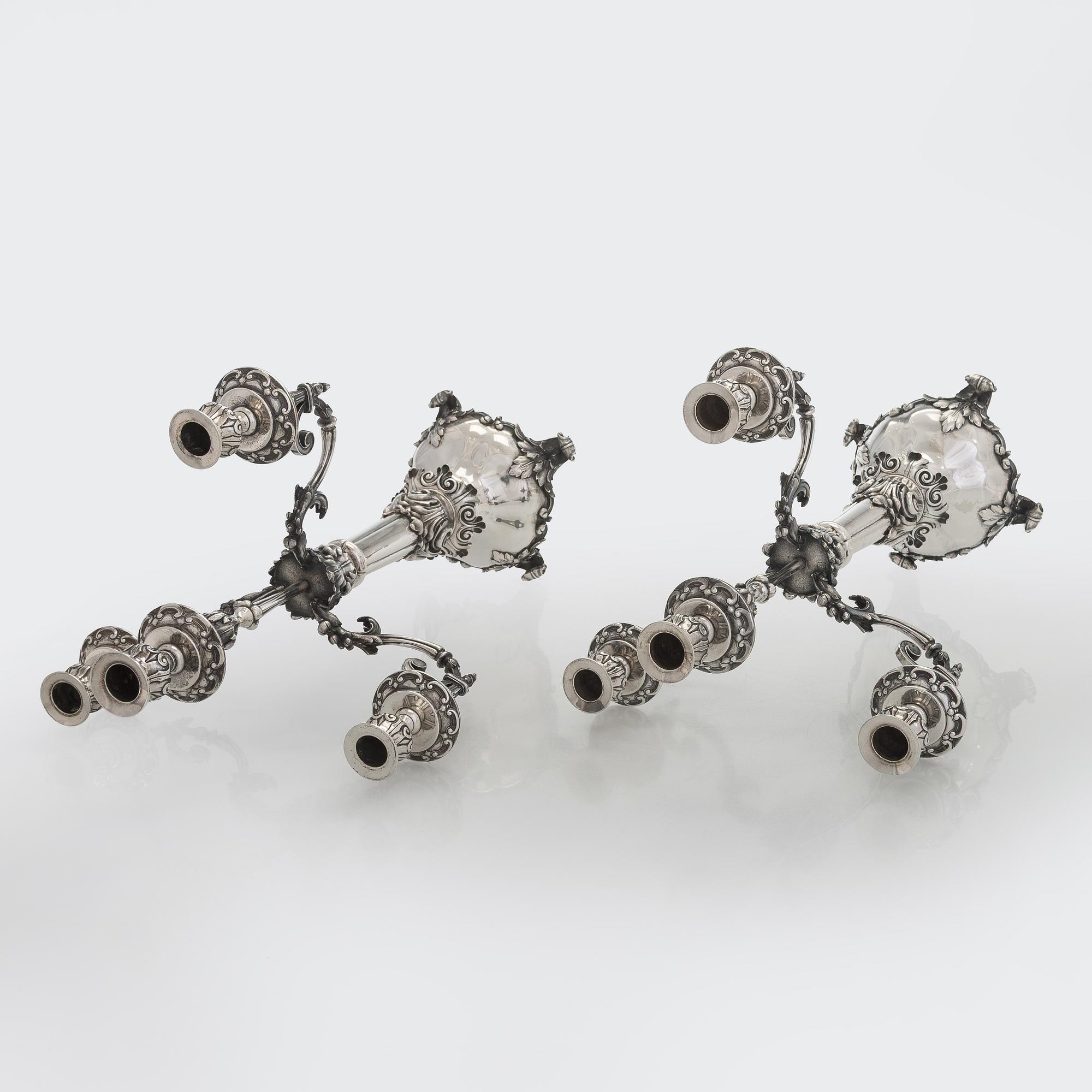 A pair of silver candelabra, maker marks of Carl Johan Tegelsten, Saint Petersburg 1850.