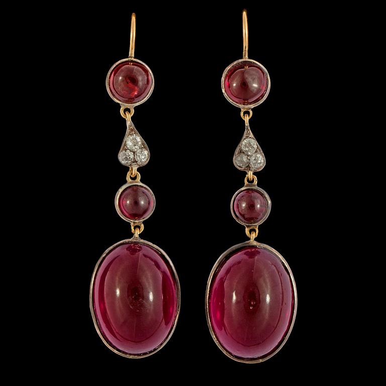 A pair of cabochon cut garnet, red paste and diamond earrings.