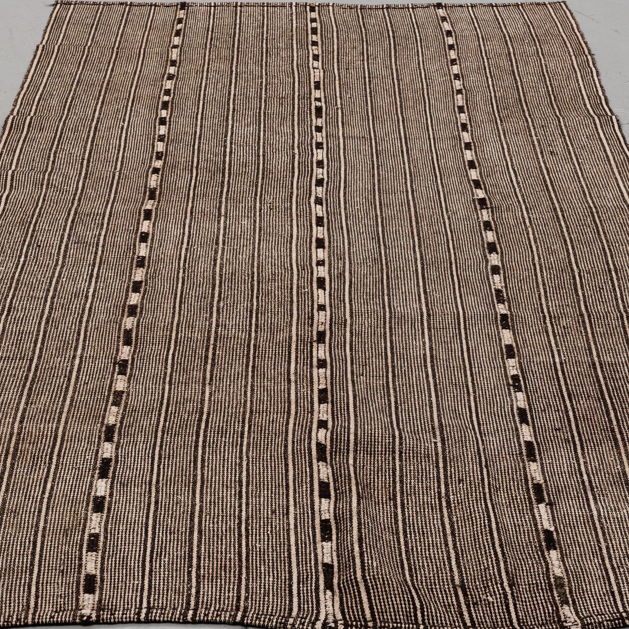 A CARPET, flat weave, around 274 x 150 cm.