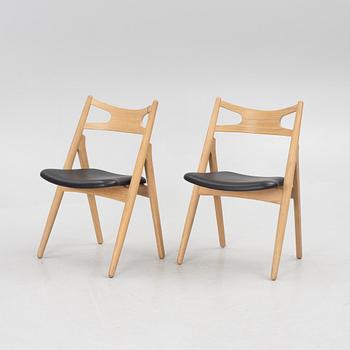 Hans J Wegner, a pair of chairs, model CH 29 "The Savbuk Chair", Carl Hansen.