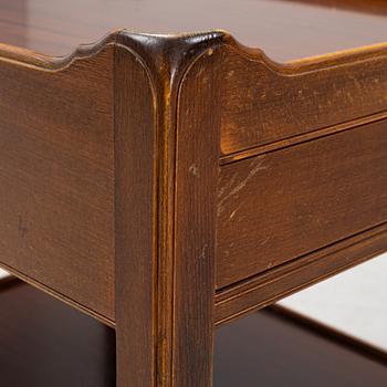 A pair of mahogany and stained beech bedside tables, mid 20th Century.