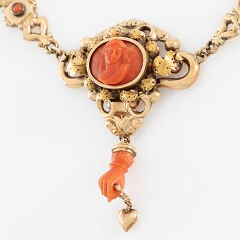 Necklace in 14K gold with carved coral. Probably around the turn of the century 1900.
