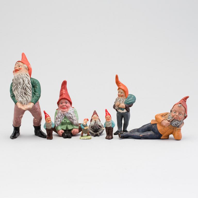 A lot of eight painted terracotta santa claus figurines first half of the 20th century.