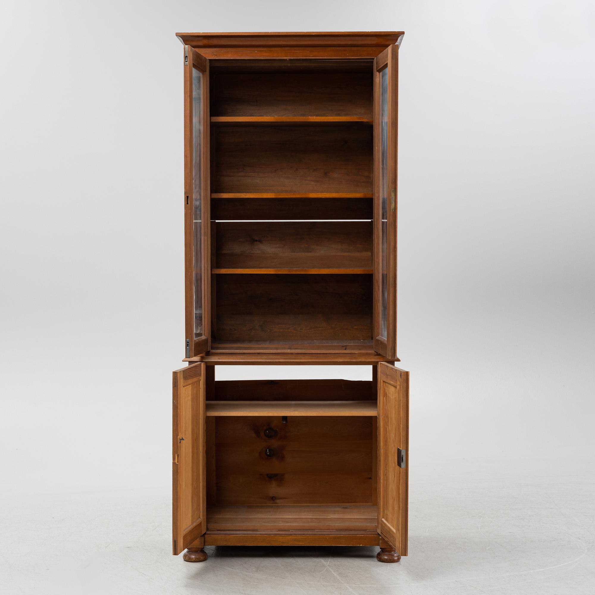 A pine cabinet, later part of the 19th Century.